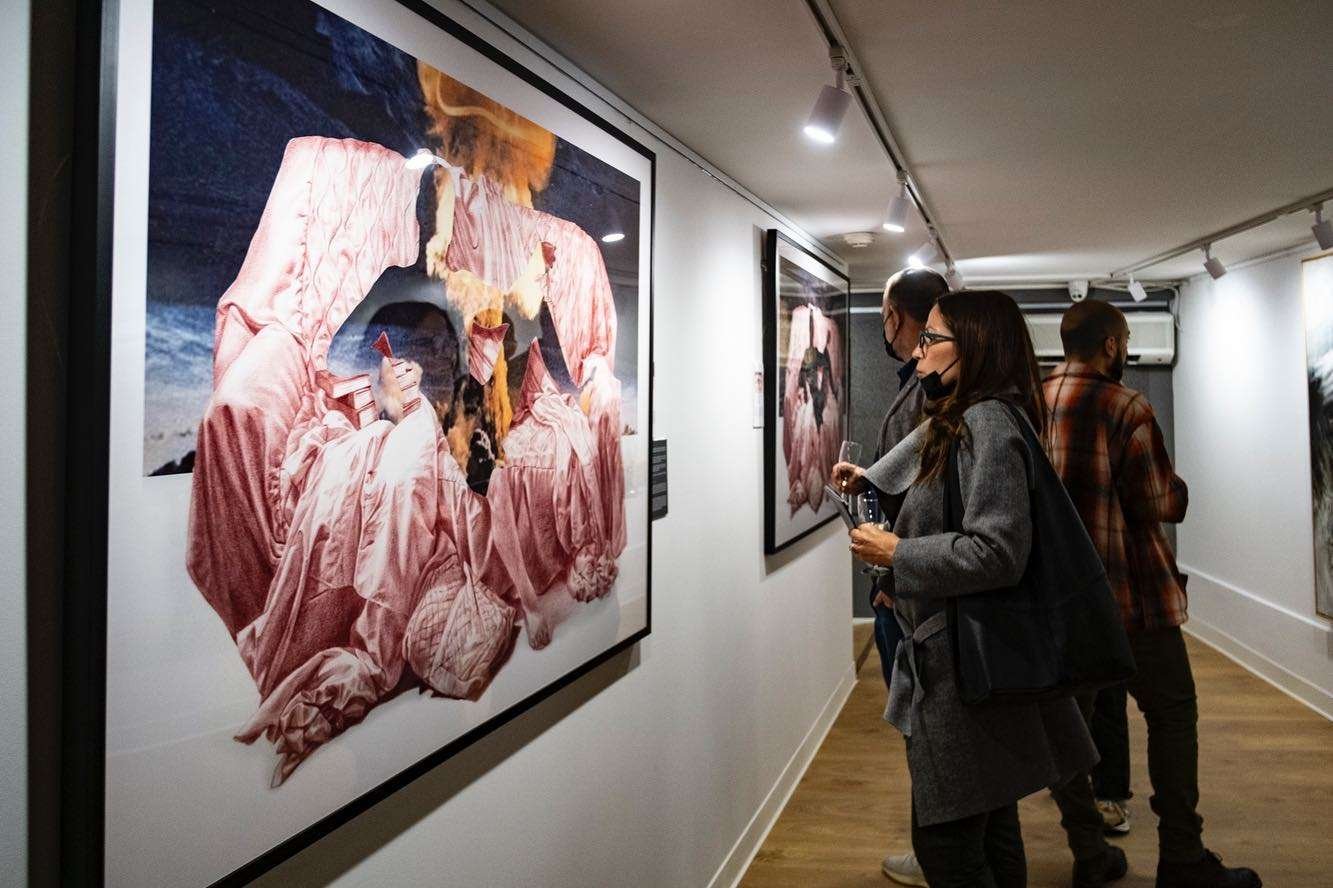 Guests looking at Darren Tanti's works at Anthropo Sans Future at Christine X Art Gallery. Photo credit- Jacob Sammut