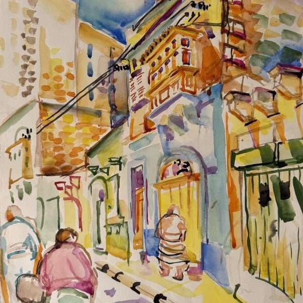 Village street 1994 by Olaug Vethal is a bright, watercolour painting of a typical Malta street (possibly in Sliema). Two people are seen walking on the street on the left whilst buildings start on the bottom right going inwards, to the left and one person facing a yellow garage door on a blue walled building with an orange Maltese balcony. To the right is a green garage door and to the left is a building block.
